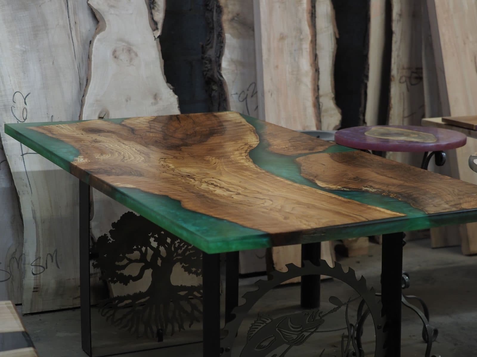 Green epoxy table with tree-shaped metal legs